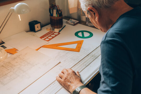 Retired man working at desk