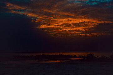 Sea beach with sky sunset or sunrise. Clouds over the sunset sea.