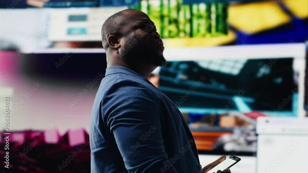 Poster african american expert exploring tech driven environment with visual data, content feeds and applic