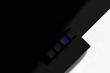Close-up of a dark keyboard with a single blue key