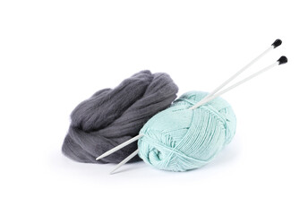 Felting wool, knitting yarn and needles isolated on white