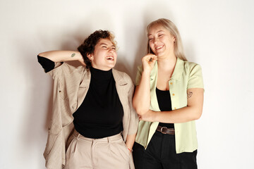Gentle portrait of two young sisters near window light