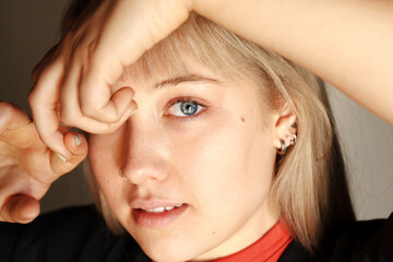 Young woman posing indoors in natural light