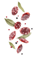 Smoked sausage slices and aromatic spices falling on white background