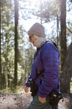 Woman hiking with camera gear
