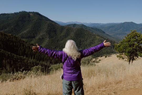 Woman Spreading Arms Over View