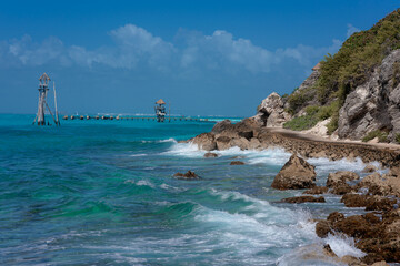 The coastline of the Caribbean Sea with white sand and rocks