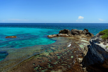 The coastline of the Caribbean Sea with white sand and rocks