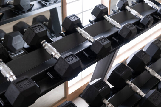 A well-organized rack of dumbbells, ready for an intense workout