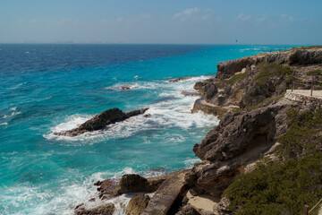 The coastline of the Caribbean Sea with white sand and rocks