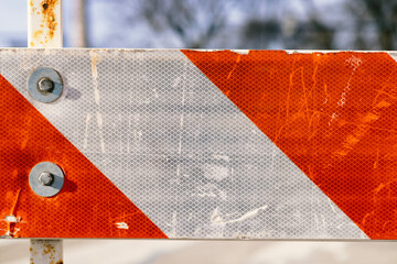 Close Up Texture of Orange White Striped Road Fence