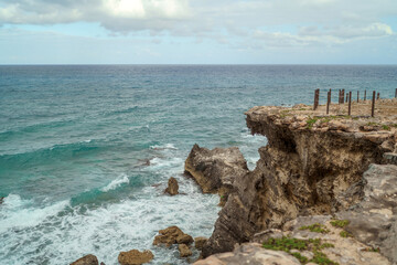The coastline of the Caribbean Sea with white sand and rocks