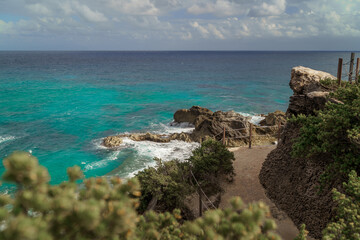The coastline of the Caribbean Sea with white sand and rocks