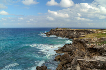 The coastline of the Caribbean Sea with white sand and rocks