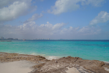 The coastline of the Caribbean Sea with white sand and rocks