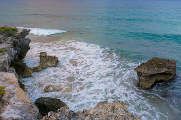 The coastline of the Caribbean Sea with white sand and rocks