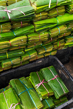 Stacked banana leaf bundles