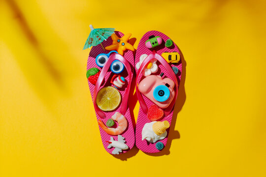 pink flip-flops with summer items