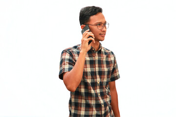 An Asian man makes a phone call with a serious and focused expression.