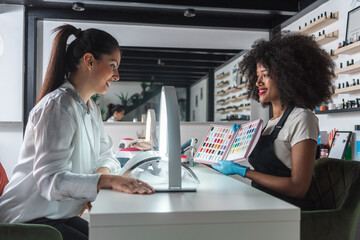 Nail Technician Presenting Color Options to a Customer