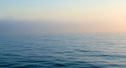 Fototapeta premium Serene misty ocean sunrise softly illuminates calm waters. AI Generated