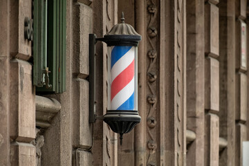 Rotating Barber Pole in Front of Modernist Building