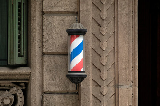 Rotating Barber Pole in Front of Modernist Building