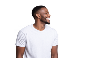 A joyful young man with a beard and short hair. wearing a plain white t-shirt. smiling against a light gray background. capturing a moment of happiness and positivity