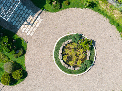 Circular Stone Planter in Elegant Gravel Garden Design