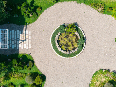 Circular Stone Planter in Elegant Gravel Garden Design