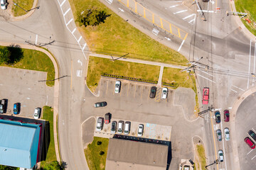 Overhead parking area with multiple vehicles, intersecting roads, green spaces, urban infrastructure parking layout, road markings, in Sayreville, Middlesex County, New Jersey.