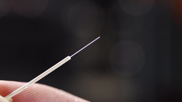 Close-up of a cleaned and cleaved optical fiber, ready for connector insertion