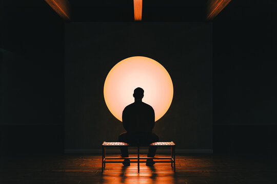 Man Contemplates Lighting Orb Art