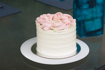 Simple elegant vanilla raspberry cake with buttercream icing