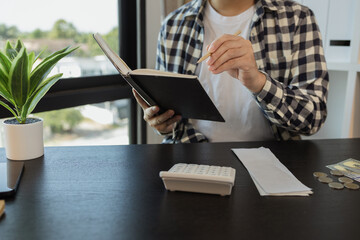 he is calculating the amount of money from all his income to allocate to various monthly expenses,...