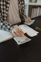 he is calculating the amount of money from all his income to allocate to various monthly expenses,...
