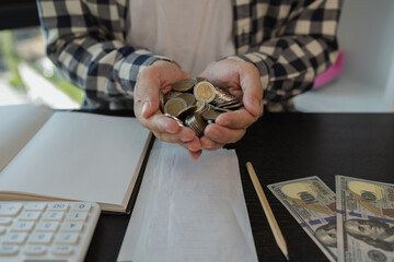 he has a lot of coins, he saves for retirement, he puts the coins in a piggy bank, the piles of...