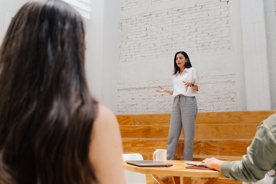 Group of young business people having a meeting.