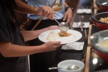scooping the food, catering, dinner time