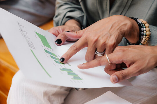 Female entrepreneur holding document.