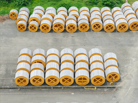 Industrial Cable Reels Arranged in Warehouse Storage Yard