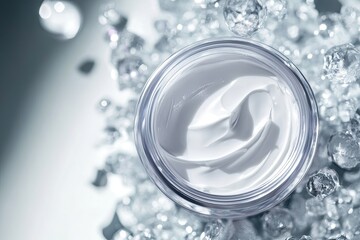 Cream jar atop ice crystals.  Atop a bed of ice crystals, a clear jar holds a smooth, white cream