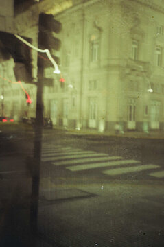 Blurred night scene reflecting lights of the city