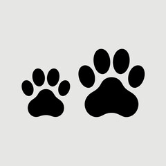 Animals vector with two black paw prints, one large and one small, perfect for petrelated designs and playful animalthemed projects.