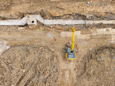 Aerial View of Excavator Installing Drainage Infrastructure