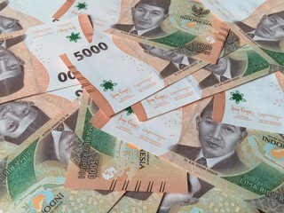 Indonesian money, close up five thousand rupiah,5000 banknotes scattered 