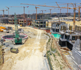 Large Construction Site with Buildings and Cranes Under Progress