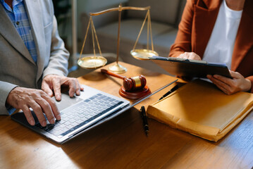 Two lawyers are discussing about contract paper, law matters determination, pointing.law