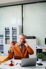 Male lawyer consulting on legal cases in a modern office. Ideal for law firms, corporate attorneys