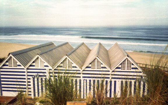 beach with striped houses in Portugal